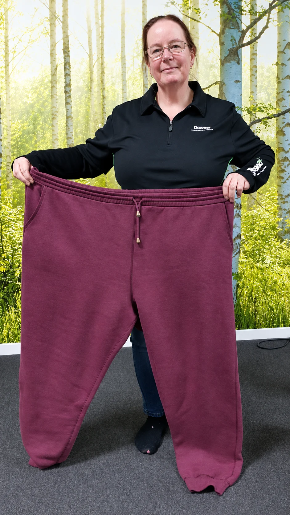 Supplied photo of a woman holding a pair of trousers in front of her